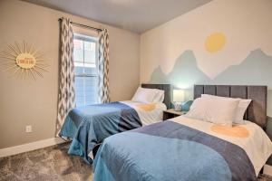 a bedroom with two beds and a window at Family-Friendly Home, 5 Mi to Downtown Billings! in Billings
