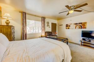 a bedroom with a bed and a flat screen tv at Pine Tree Place - Unit 4 in South Lake Tahoe