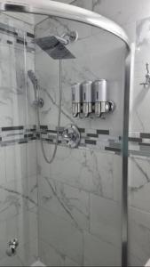 a shower in a bathroom with a glass door at Palm Springs 3-Bedroom 2-Bath 5 Miles to the Beach in Lake Worth