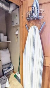 a surfboard hanging on a wall in a room at Driftin' Cabanas in Chelan