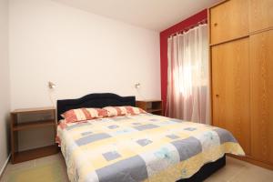 a bedroom with a bed and a dresser at Apartments with a parking space Valbandon, Fazana - 2214 in Fondole