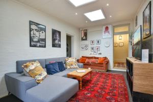 a living room with a couch and a table at Coolangatta in Katoomba