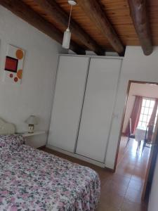 a bedroom with a bed in a room with a window at Rincón Spa Seule in Ciudad Lujan de Cuyo