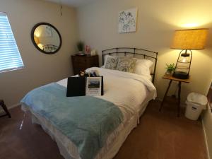 a bedroom with a bed with a sign on it at Sommer Hus-Best value in Southern California Wine Country in Temecula