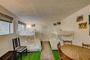 a room with two bunk beds and a bed at Pine Tree Place - Unit 7 in South Lake Tahoe