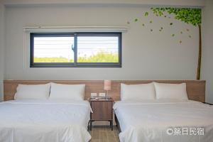 Postel nebo postele na pokoji v ubytování Chikubi Homestay