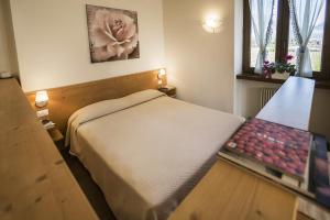 Postel nebo postele na pokoji v ubytování Le Servite Apartments