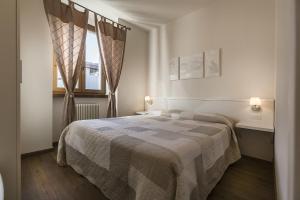Postel nebo postele na pokoji v ubytování Le Servite Apartments