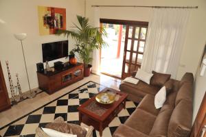 a living room with a couch and a table at Villa Calero in Playa Blanca