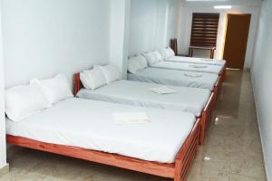 Ein Bett oder Betten in einem Zimmer der Unterkunft MIST RESIDENCY
