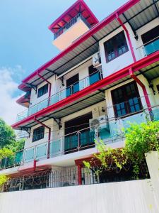 a building with balconies on the side of it at Cinnamon Fence in Colombo