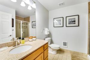 a bathroom with a sink and a toilet at The Ocean Is Calling in Westport