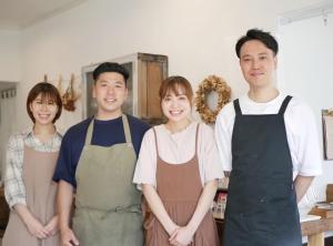 a group of people standing in a kitchen at caf&eacute;&GuestHouse kaziya in Ichinoseki
