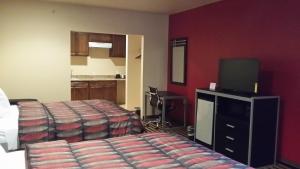 Postel nebo postele na pokoji v ubytování Texan Inn and Suites Tilden