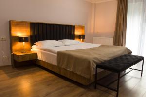 Postel nebo postele na pokoji v ubytování Lileo Inn Hotel