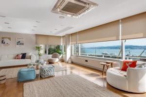 a living room with a view of the water at Amazing Bosphorus View Apartment in Istanbul