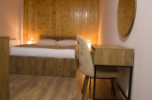 Postel nebo postele na pokoji v ubytování Lileo Inn Hotel