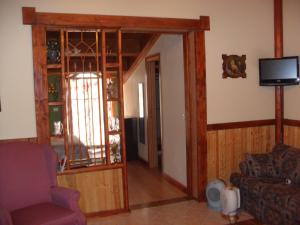 a living room with a couch and a tv at Giamia Villas in Sulmona