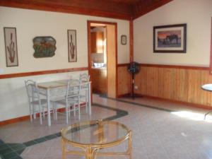 a dining room with a glass table and chairs at Giamia Villas in Sulmona