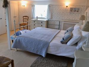 Katil atau katil-katil dalam bilik di Southview Cottage