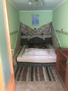 Postel nebo postele na pokoji v ubytování Budai Vendégház
