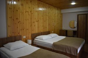 Postel nebo postele na pokoji v ubytování Lileo Inn Hotel