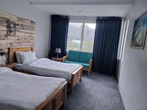 Postel nebo postele na pokoji v ubytování Silk Route Lodge - Hunza