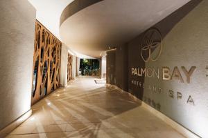 a hallway with the rauman bay hotel and spa on the wall at Palmon Bay Hotel & Spa in Herceg-Novi