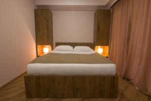 Postel nebo postele na pokoji v ubytování Lileo Inn Hotel