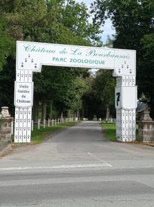 a sign for the entrance to a park with a road at Maison atypique et charmante in Pleugueneuc