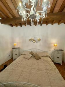 Ένα ή περισσότερα κρεβάτια σε δωμάτιο στο Villa Borgo Soale