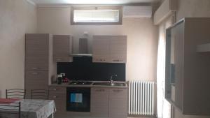 Kuchyň nebo kuchyňský kout v ubytování Appartamento Fiore