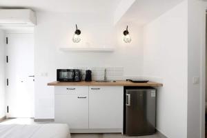 Kuchyň nebo kuchyňský kout v ubytování Apartamentos Vexèr