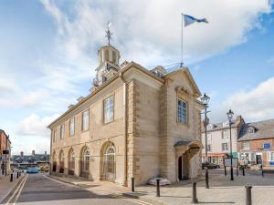 a building with a flag on top of it at The Loft At Brackley Town Hall in Brackley