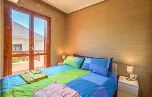 A bed or beds in a room at Amazing Apartment In Marina Di Ragusa