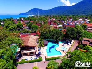 an aerial view of a resort with a swimming pool at Canto do mar Maresias in Maresias