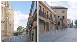 una calle de la ciudad con un edificio y una iglesia en Apartamentos Boutique Puerta de Reyes, en Toledo