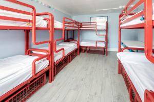 a row of bunk beds in a room at Astor Victoria Hostel in London