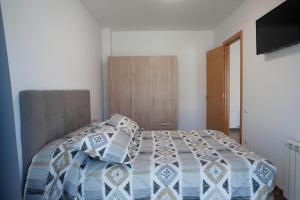 Posteľ alebo postele v izbe v ubytovaní Apartament Bisaura de Ter