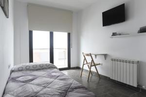 Posteľ alebo postele v izbe v ubytovaní Apartament Bisaura de Ter