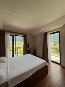 Postel nebo postele na pokoji v ubytování Lileo Inn Hotel