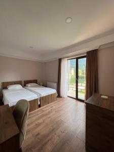 Postel nebo postele na pokoji v ubytování Lileo Inn Hotel