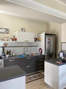 a kitchen with a black and white refrigerator at La casa di Silvia in Cantalupo in Sabina