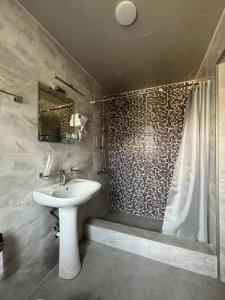 Koupelna v ubytování Lileo Inn Hotel
