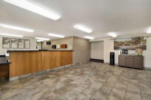 a large room with a waiting room with a counter at Baymont by Wyndham Elko in Elko