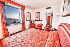 Postel nebo postele na pokoji v ubytování Relais Casali della Cisterna