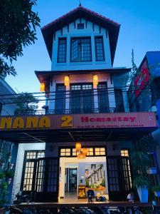 a building with a sign that reads manana hereditary at Nana 2 Homestay in Hue