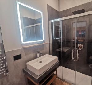 a bathroom with a sink and a shower at Maqueda Mood in Palermo