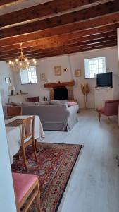 a large living room with a couch and a table at La Bretagne ça vous gagne in Ploufragan