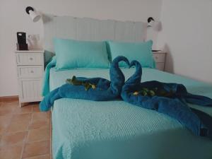 A bed or beds in a room at Casa marinera en la Orilla del mar